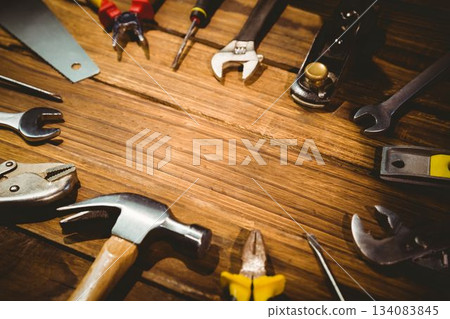 Flat design vector illustration is depicting hand tools arranged on wooden workbench, copy space 134083845