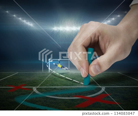 Hand drawing tactics on football pitch 134083847