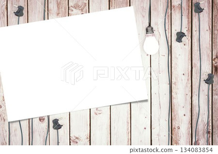 Plugs and paper on wooden floor 134083854