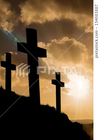 Cross religion symbol shape over sunset sky Cross religion symbol shape over sunset sky 134083887