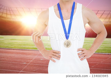 Midsection of athlete standing at stadium Midsection of athlete standing at stadium 134083945