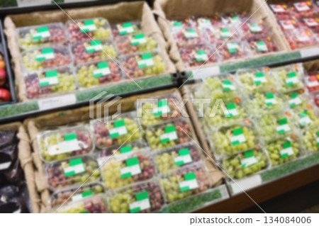 Organic fruits in plastic boxes for sale 134084006