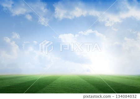 Football pitch under blue sky 134084032