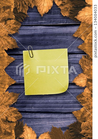 Autumn leaves with yellow note 134084033