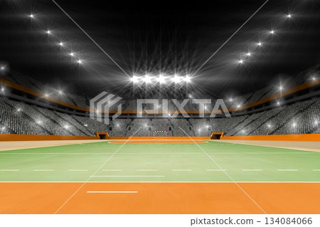 Displaying empty stadium with green field, orange border, floodlights, goalpost, tiered seating Displaying empty stadium with green field, orange border, floodlights, goalpost, tiered seating 134084066