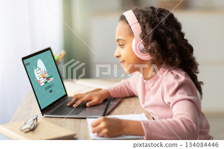 Online Lesson. Black Teen Schoolgirl Study Remotely With Laptop At Home, African American Female Student Browsing E-Learning Website On Computer, Doing Homework In Internet, Creative Collage Online Lesson. Black Teen Schoolgirl Study Remotely With Laptop At Home, African American Female Student Browsing E-Learning Website On Computer, Doing Homework In Internet, Creative Collage 134084446