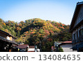 Autumn scenery of mountains colored by autumn leaves and Japanese townscapes 134084635