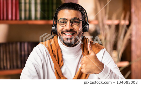 I Like E-Learning. Happy Indian Male Student Gesturing Thumbs Up To Camera Approving Educational Online Course Sitting At Home. Distance Learning, Remote Study And Modern Education I Like E-Learning. Happy Indian Male Student Gesturing Thumbs Up To Camera Approving Educational Online Course Sitting At Home. Distance Learning, Remote Study And Modern Education 134085008