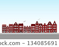 Illustration of a row of classic European-style red brick buildings, featuring arched windows, decorative gables, and varied rooflines, giving each building a unique character. 134085691