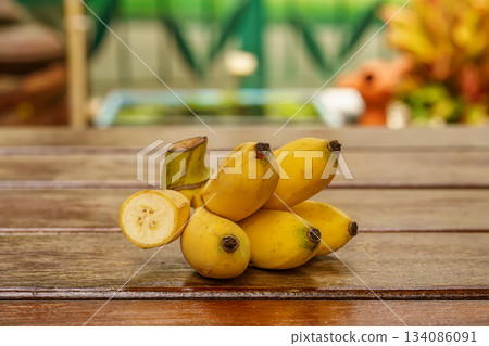 Small yellow bananas on table 134086091