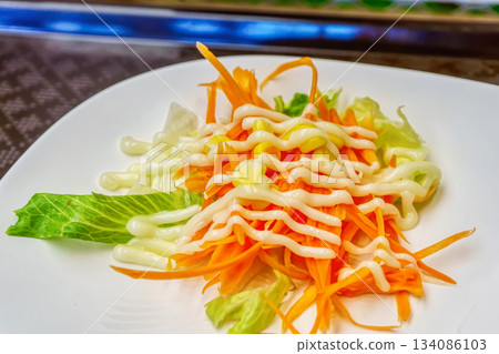 Salad with creamy dressing Salad with creamy dressing 134086103