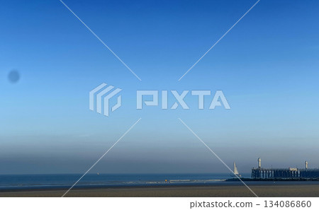 A Serene and Picturesque Coastal View at Dusk with a Clear Blue Sky Above the Ocean A Serene and Picturesque Coastal View at Dusk with a Clear Blue Sky Above the Ocean 134086860