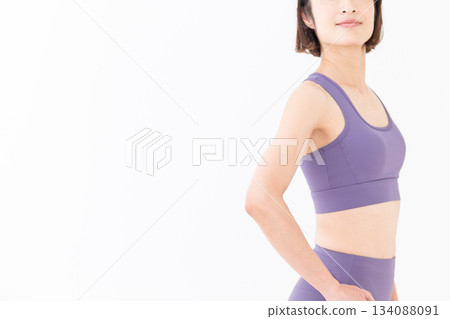 Slim middle-aged woman in yoga wear Slim middle-aged woman in yoga wear 134088091