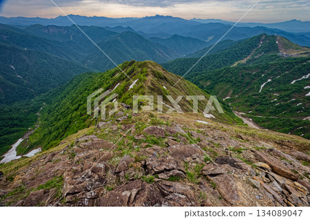 Morning view of Tenjindai and the mountain ranges of Oze, Nikko, and Joshu Hotaka from the climb up the Nishikuro Ridge of Mt. Tanigawa Morning view of Tenjindai and the mountain ranges of Oze, Nikko, and Joshu Hotaka from the climb up the Nishikuro Ridge of Mt. Tanigawa 134089047