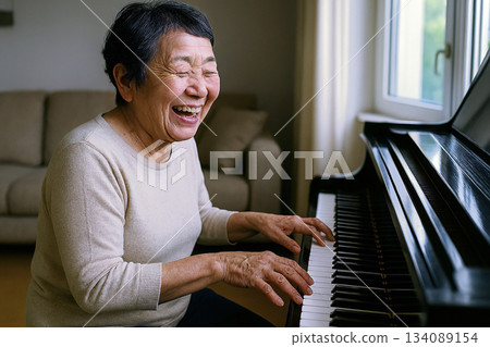 Senior woman playing piano 134089154