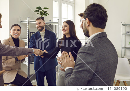 Team leader handshaking employee congratulating with professional achievement 134089190