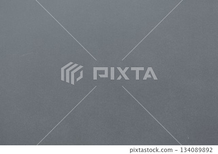 Flat design showing subtle speckled grey wall featuring gentle tonal variations, copy space 134089892