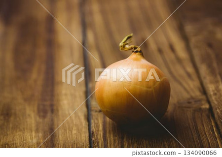 Fresh onion on wooden table Fresh onion on wooden table 134090066
