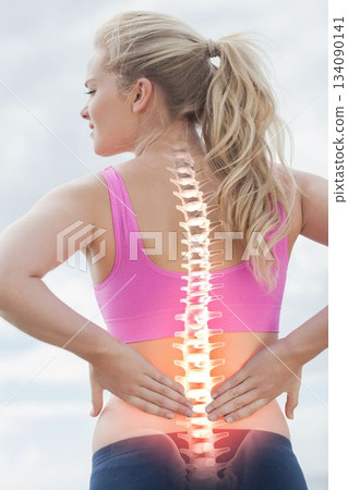 Highlighted spine of woman with back pain Highlighted spine of woman with back pain 134090141