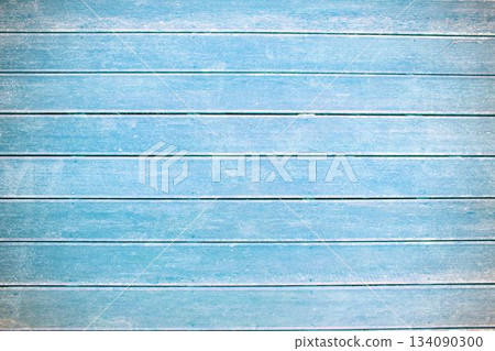 Weathered light blue wooden plank wall showing chipping paint and grain texture in flat design 134090300