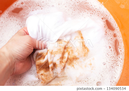 Soaking stained white clothes in detergent for laundry and hygiene Soaking stained white clothes in detergent for laundry and hygiene 134090534