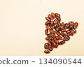 Dates forming heart on beige background for healthy love 134090544