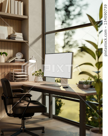 White screen computer on wooden table and armchair in glass wall room with green nature view outside. White screen computer on wooden table and armchair in glass wall room with green nature view outside. 134090739
