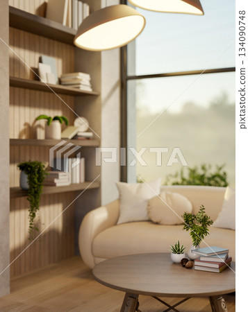 A round wooden stool table under lamp light and white sofa in a living room with nature view outside 134090748