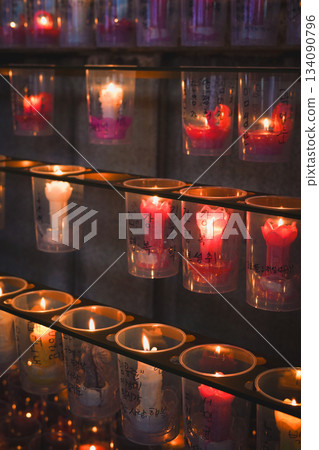 Rows of Prayer Candles in a Korean Buddhist Temple, Carrying Wishes Rows of Prayer Candles in a Korean Buddhist Temple, Carrying Wishes 134090796