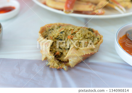 Korean Style Fried Rice with Crab Innards Served in a Snow Crab Shell Korean Style Fried Rice with Crab Innards Served in a Snow Crab Shell 134090814