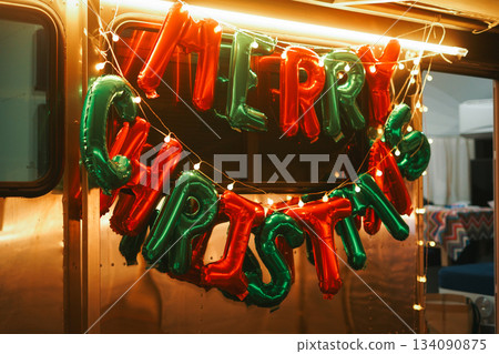 Festive Red and Green MERRY CHRISTMAS Balloons on a Trailer Festive Red and Green MERRY CHRISTMAS Balloons on a Trailer 134090875