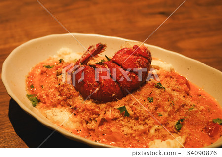 Decadent Seafood Risotto with Lobster Tail and Rich Rose Sauce Decadent Seafood Risotto with Lobster Tail and Rich Rose Sauce 134090876