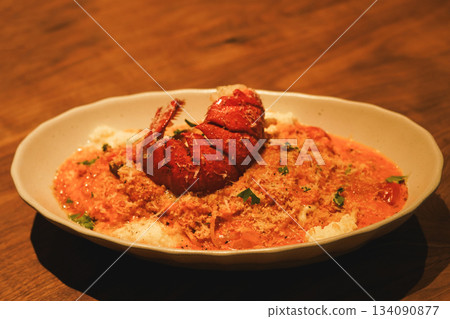 Decadent Seafood Risotto with Lobster Tail and Rich Rose Sauce Decadent Seafood Risotto with Lobster Tail and Rich Rose Sauce 134090877