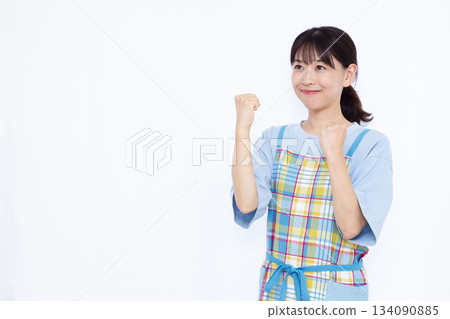 A housewife doing a fist pump A housewife doing a fist pump 134090885