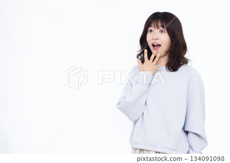 Smiling and surprised woman Smiling and surprised woman 134091098