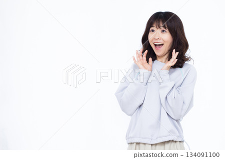 Smiling and surprised woman Smiling and surprised woman 134091100