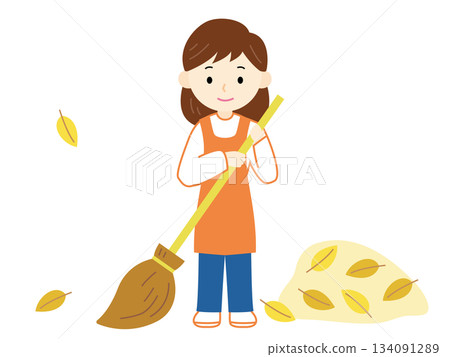 圖:一位婦女正在清理落葉 圖:一位婦女正在清理落葉 134091289