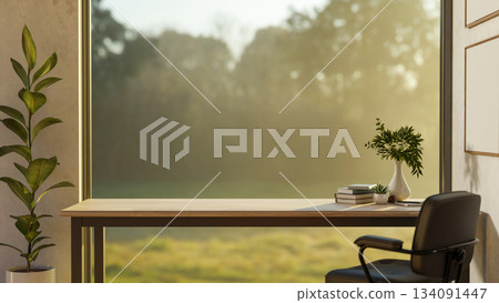 Books and decors on wooden table with armchair in front of a doorway with green nature outside. Books and decors on wooden table with armchair in front of a doorway with green nature outside. 134091447