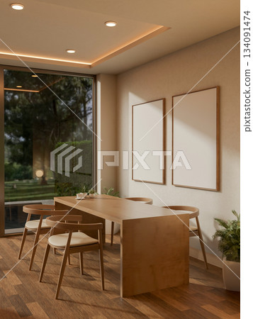 A coffee cup on wooden counter and armchairs in a cafe with blank frames hanging on the wall 134091474