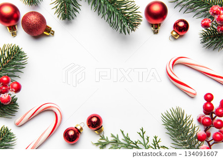 Christmas holiday frame with festive ornaments and candy canes 134091607