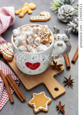 Reindeer mug with hot chocolate and gingerbread cookies Reindeer mug with hot chocolate and gingerbread cookies 134091613