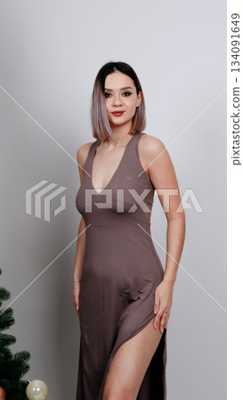 Female model posing in a dusty pink seamless bodysuit Female model posing in a dusty pink seamless bodysuit 134091649