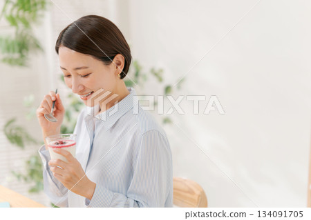 A woman eating dessert A woman eating dessert 134091705