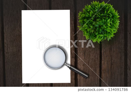 Magnifying glass on paper Magnifying glass on paper 134091786