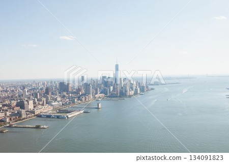 Cluster of skyscrapers is rising from waterfront peninsula in flat design with piers and boats Cluster of skyscrapers is rising from waterfront peninsula in flat design with piers and boats 134091823