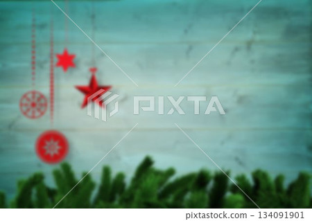 Blurred christmas decorations hanging over wood Blurred christmas decorations hanging over wood 134091901