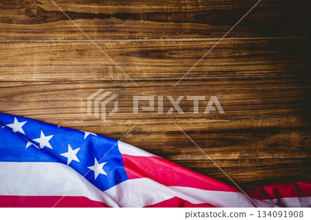 American flag section is draping over rustic wood in flat illustration showing stars stripes 134091908
