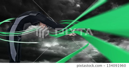 Swimmer bending against digitally generated green lines Swimmer bending against digitally generated green lines 134091960