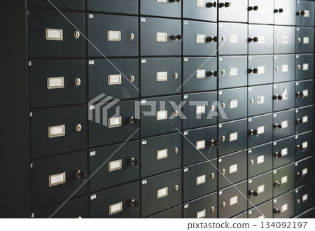 Flat design grid of safety deposit boxes is filling frame with label holders and inserted keys Flat design grid of safety deposit boxes is filling frame with label holders and inserted keys 134092197