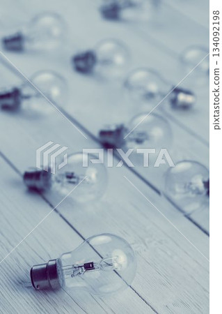 Light bulbs on white floorboard 134092198